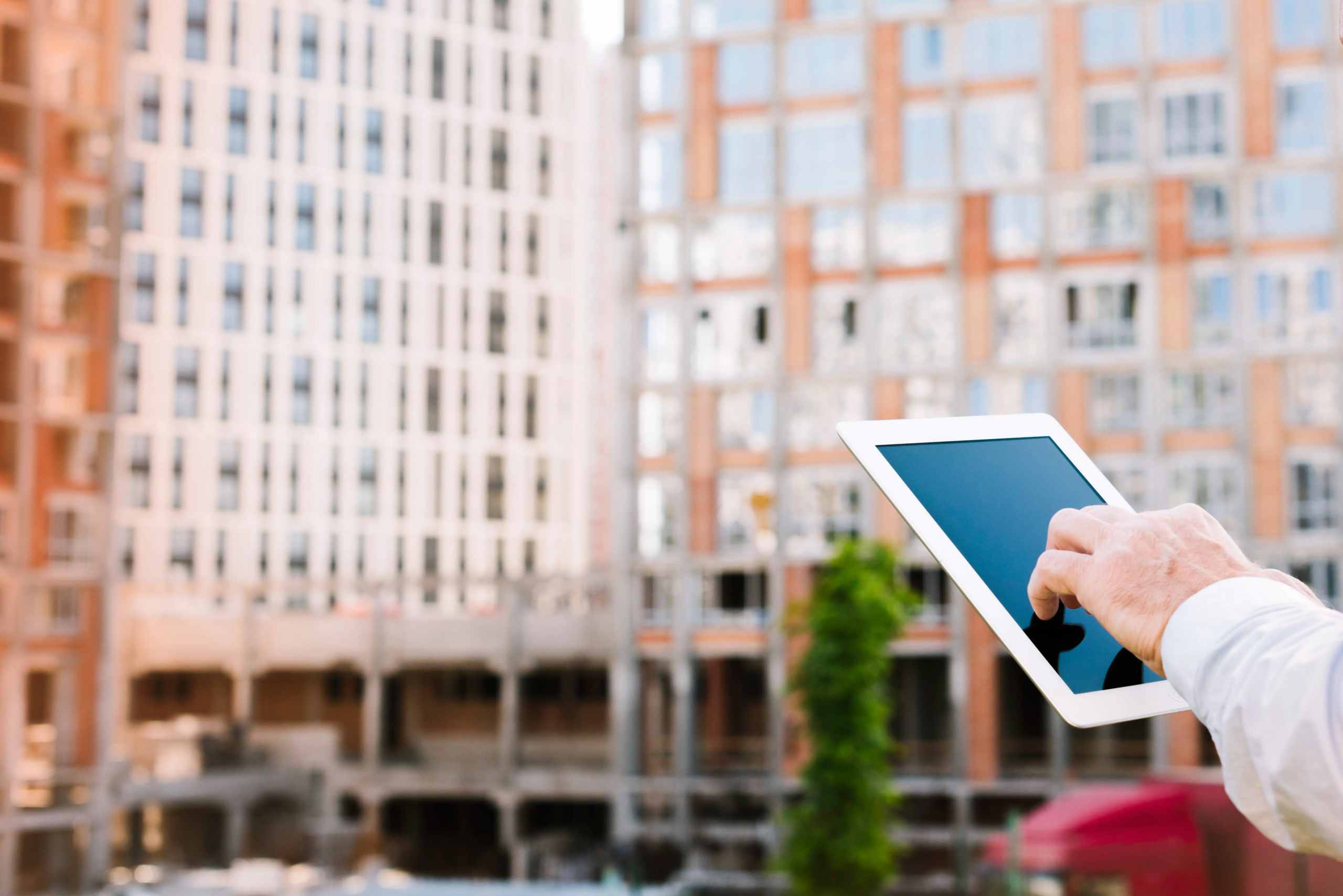 side view old man looking tablet