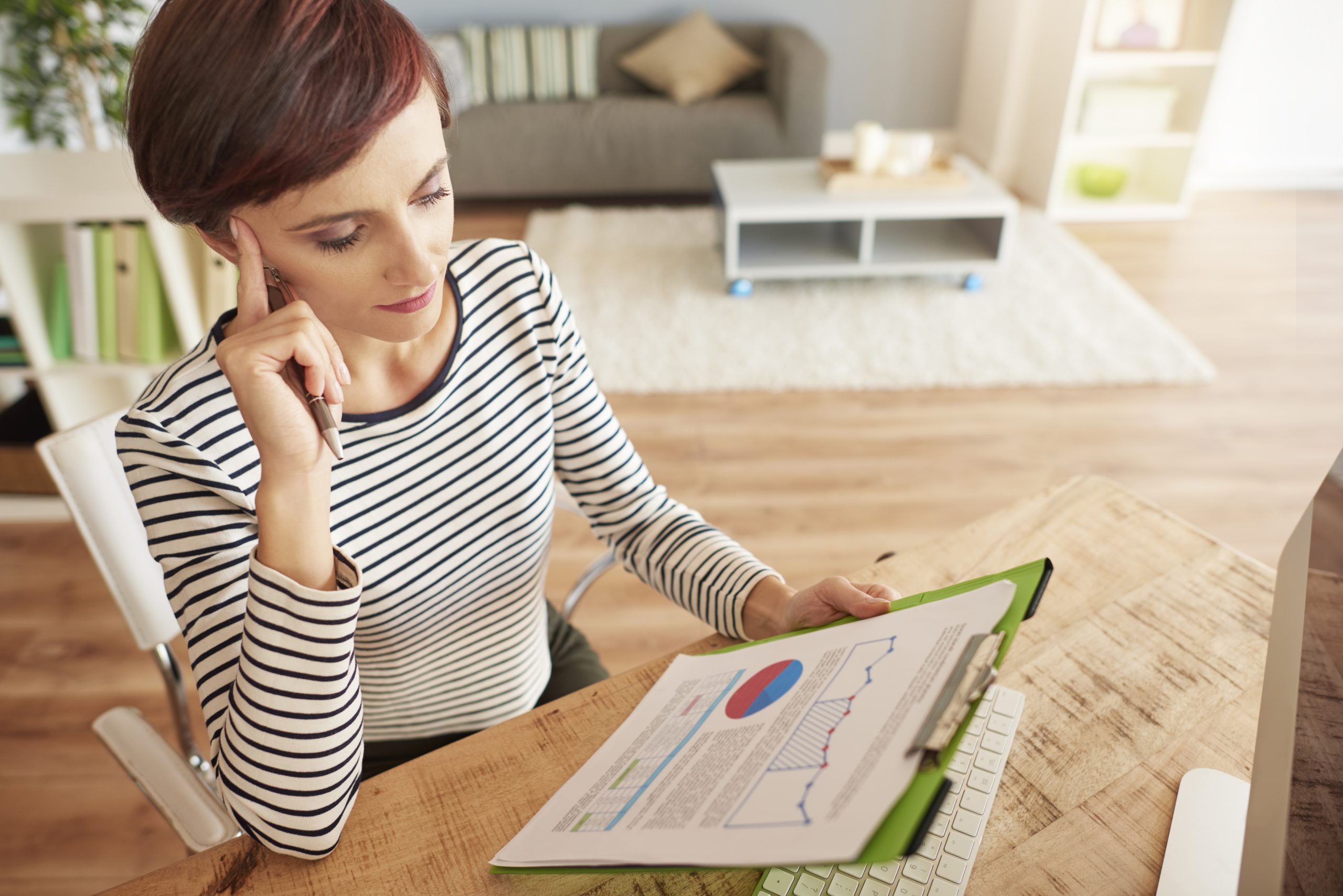 woman thinking about some important documents
